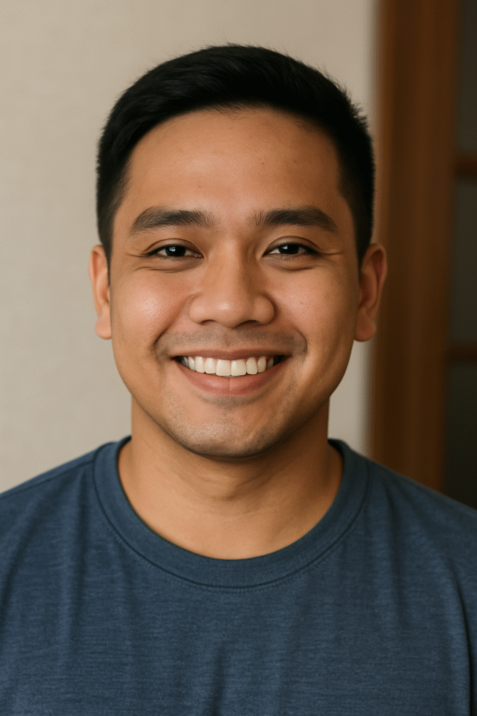 A close-up portrait of a smiling Filipino man, used to represent a satisfied student in the testimonials section.